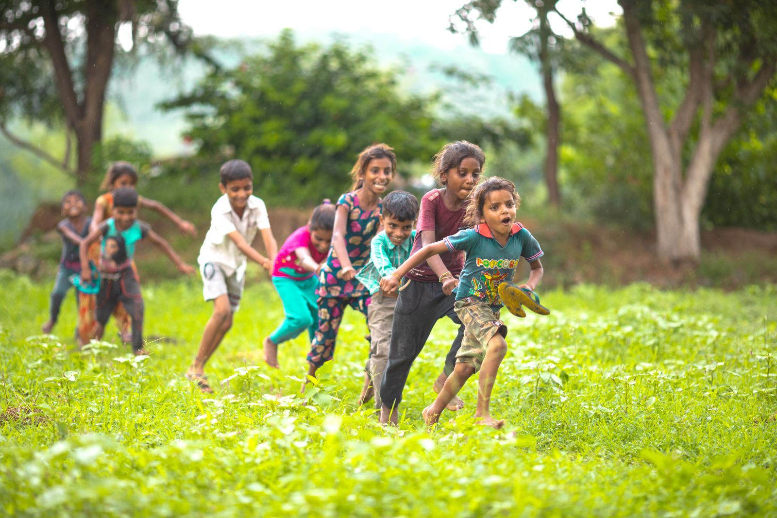 Children running in a field