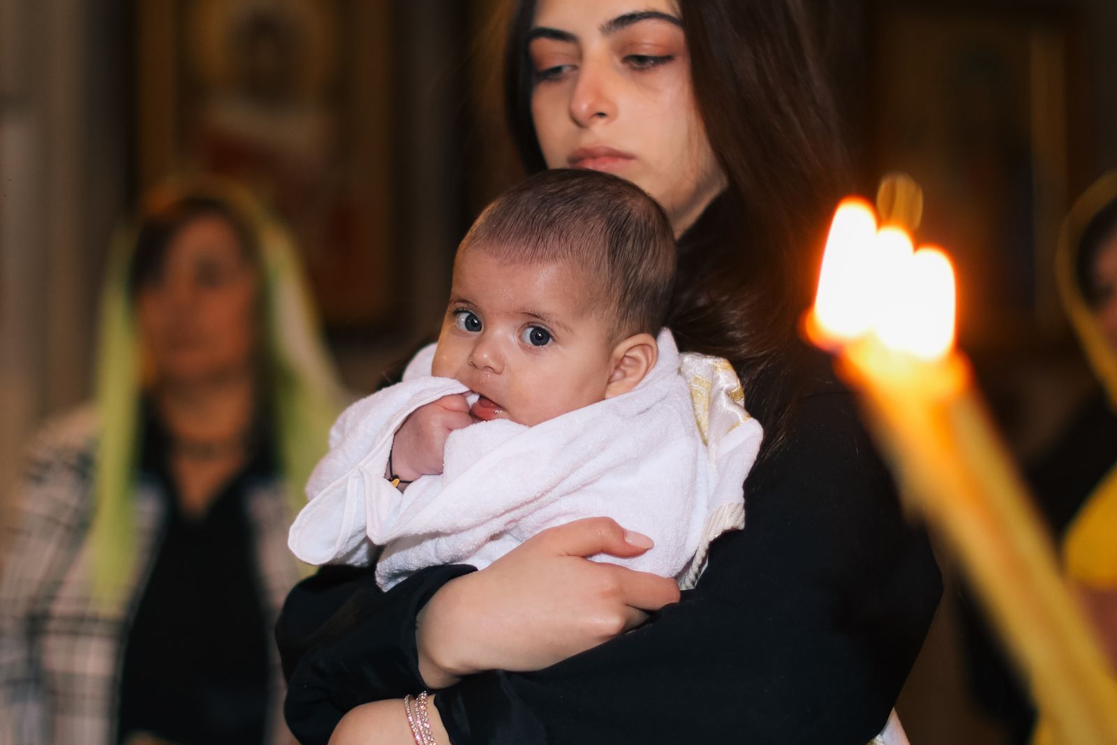 A mother holding her baby