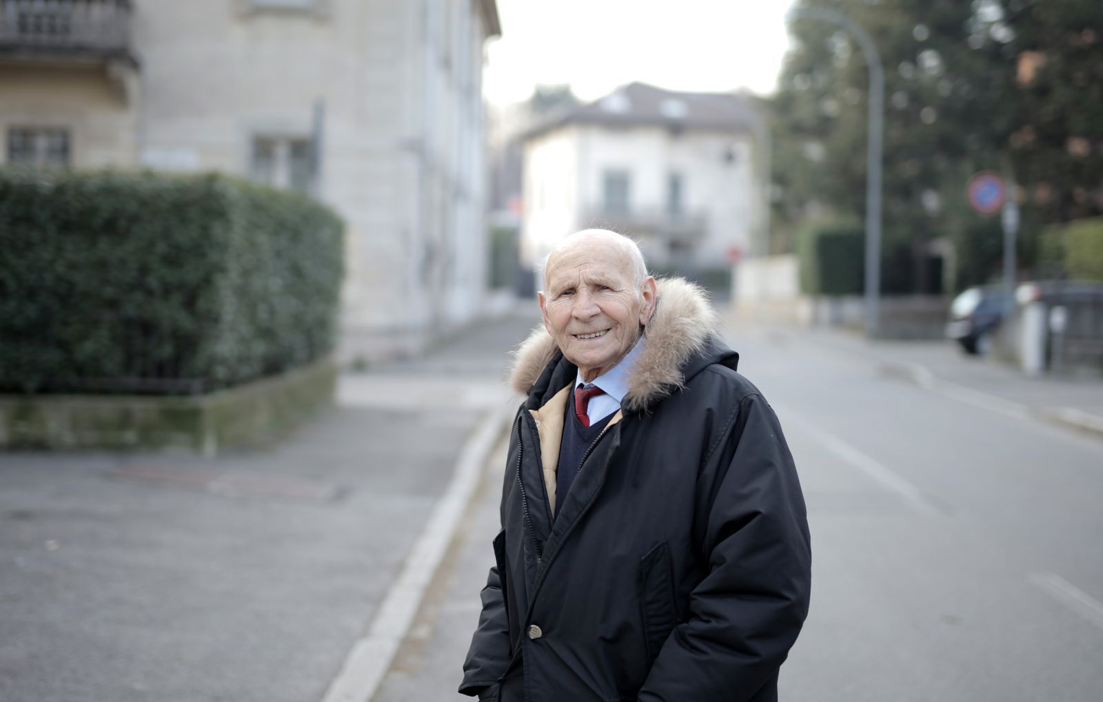 An older man smiling